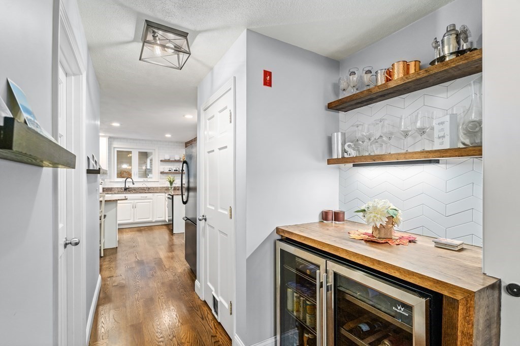 4 Robert Street Walpole, MA 02081 - Photo 9 of 37 a kitchen with stainless steel appliances a refrigerator and a stove