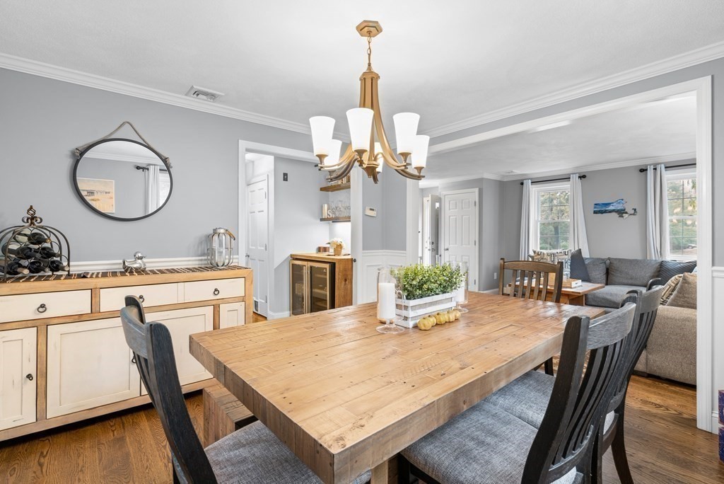 4 Robert Street Walpole, MA 02081 - Photo 10 of 37 a kitchen with a table chairs and white cabinets