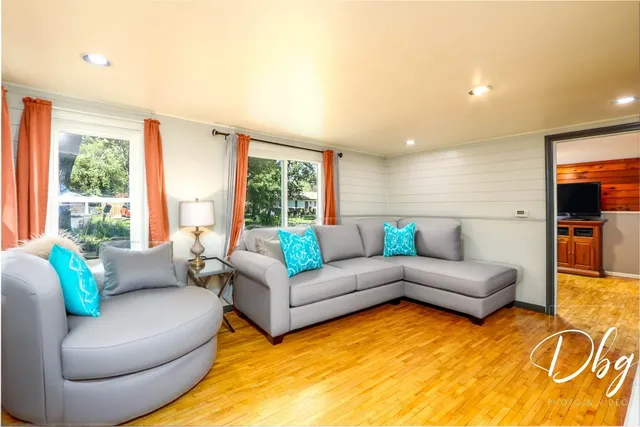 a living room with furniture and a large window