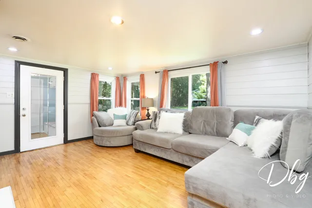 a living room with furniture and a large window