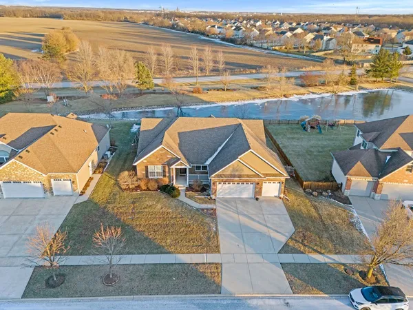 an aerial view of a house with a ocean view