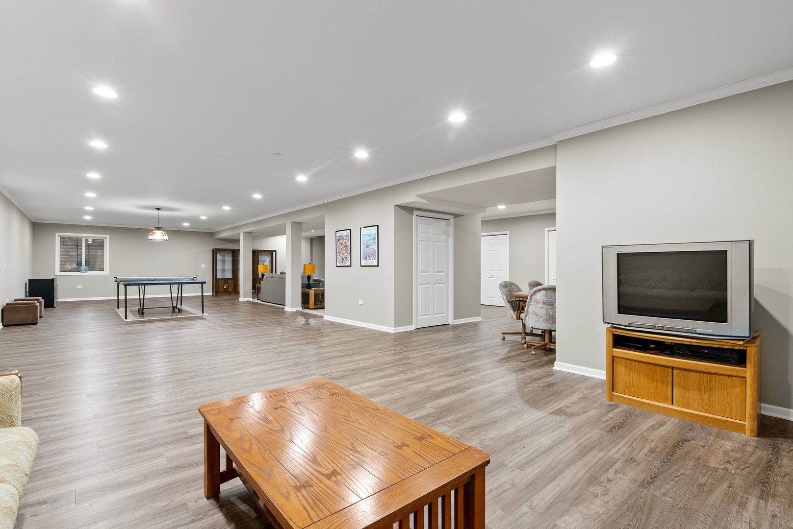 428 East Frontier Drive Minooka, IL 60447 - Photo 13 of 39 a living room with furniture and a flat screen tv