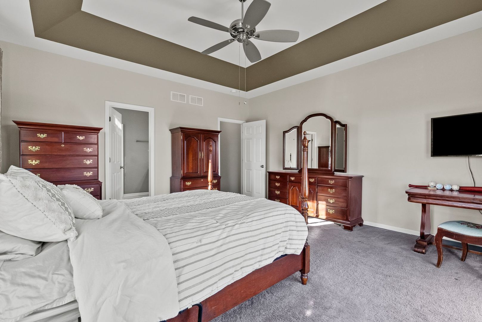 428 East Frontier Drive Minooka, IL 60447 - Photo 16 of 39 a bedroom with a bed a dresser and flat screen tv