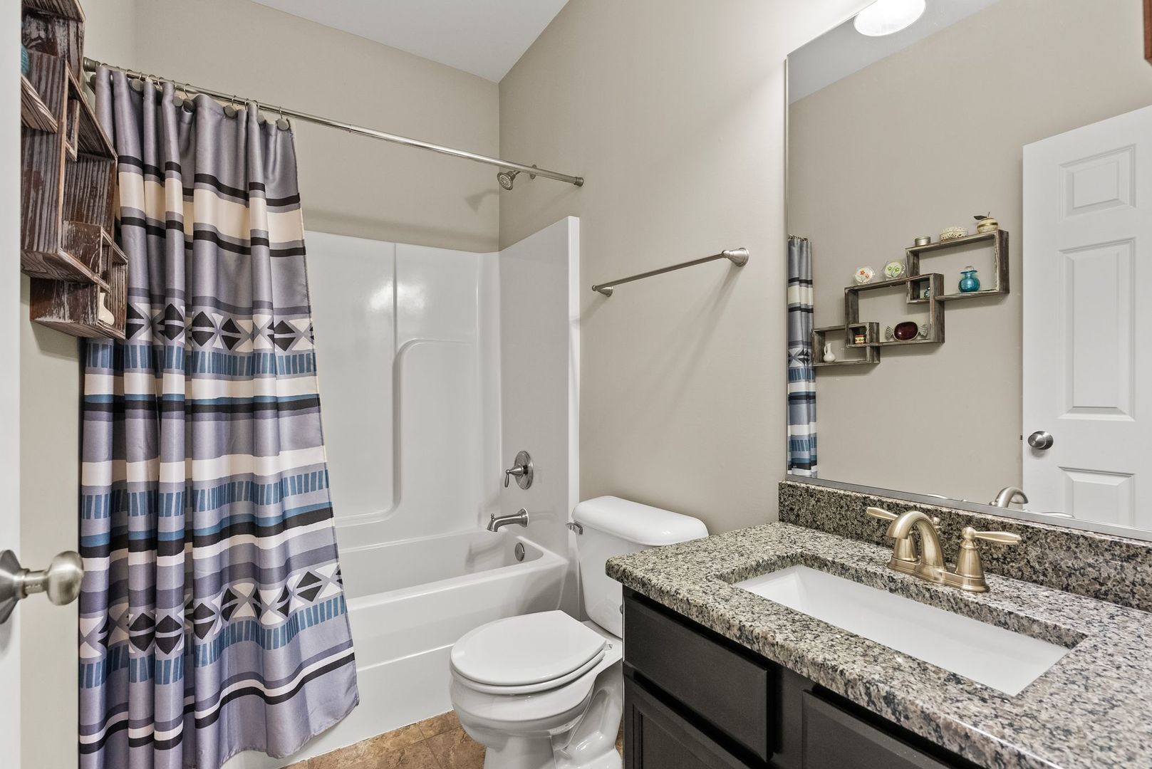 428 East Frontier Drive Minooka, IL 60447 - Photo 24 of 39 a bathroom with a granite countertop sink toilet mirror and shower