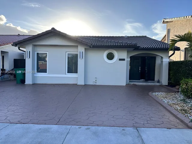a view of a house with large space and plants