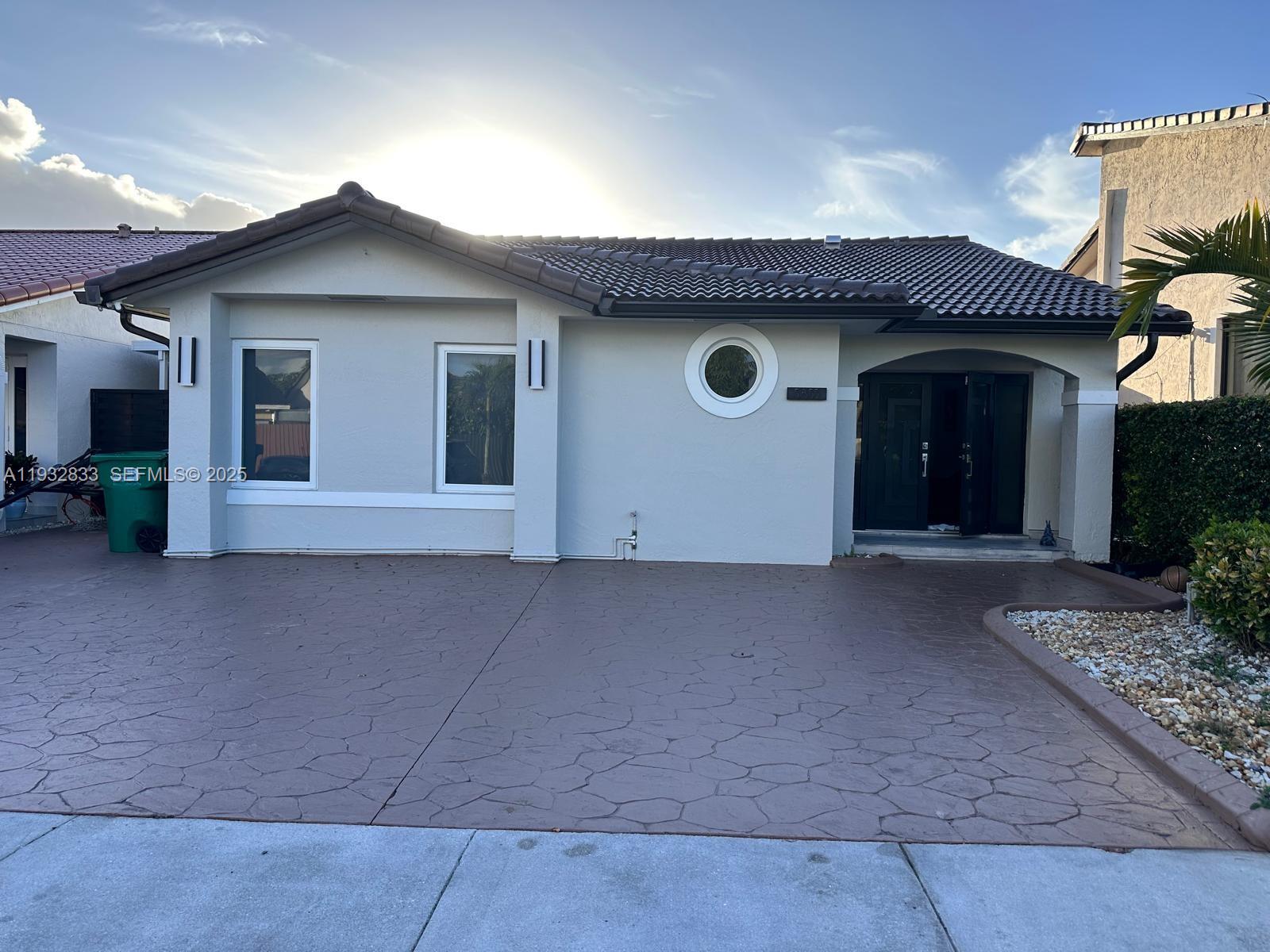 a view of a house with large space and plants