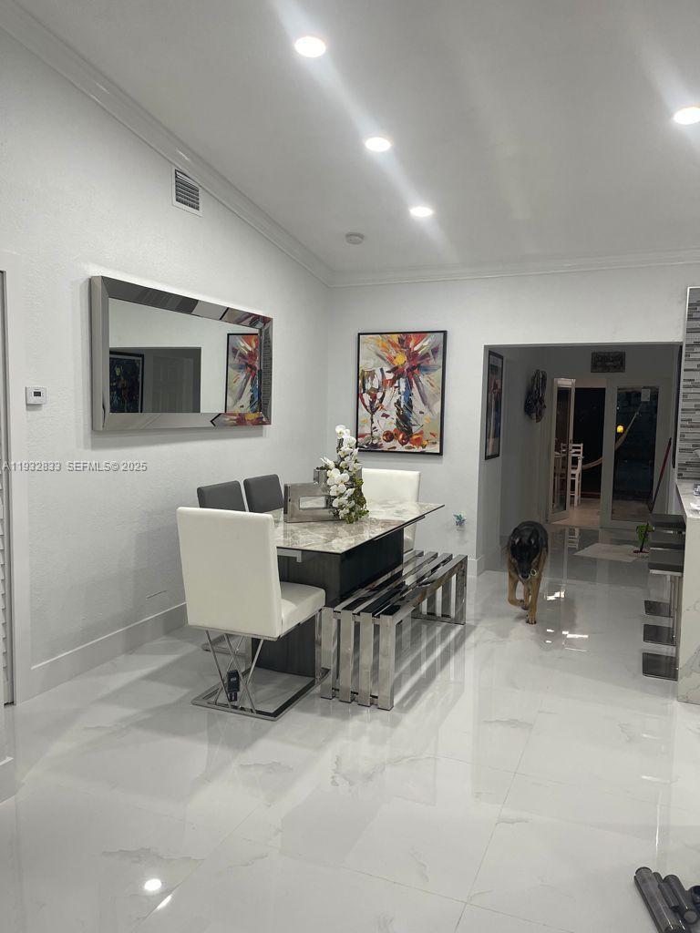 5855 Southwest 128th Court, Unit 5855 Miami, FL 33183 - Photo 5 of 12 a living room with furniture and a flat screen tv