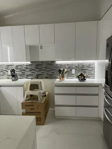 a kitchen with a sink and a window