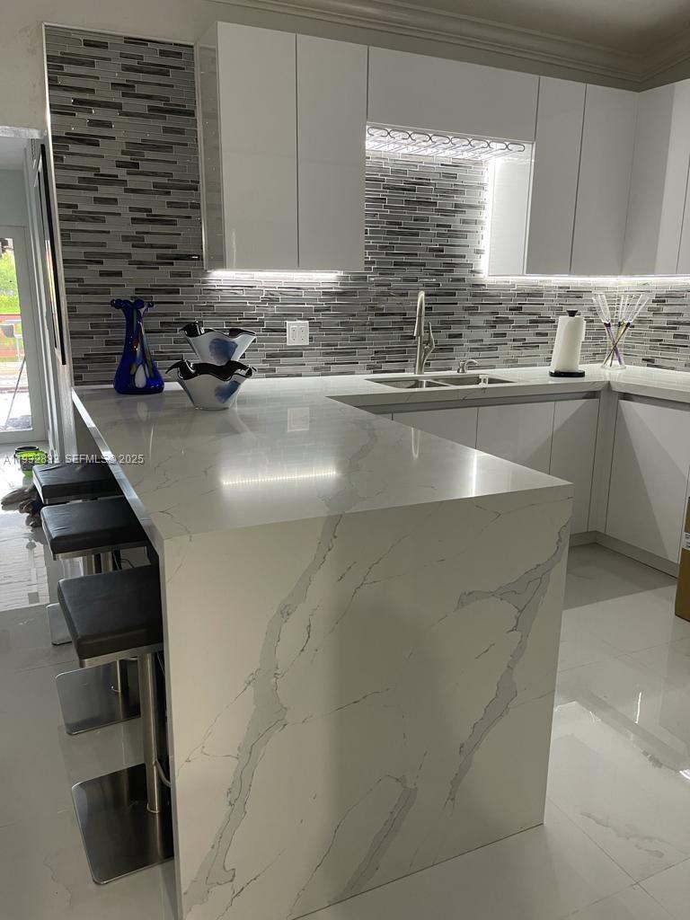 5855 Southwest 128th Court, Unit 5855 Miami, FL 33183 - Photo 8 of 12 a kitchen with a sink and a window