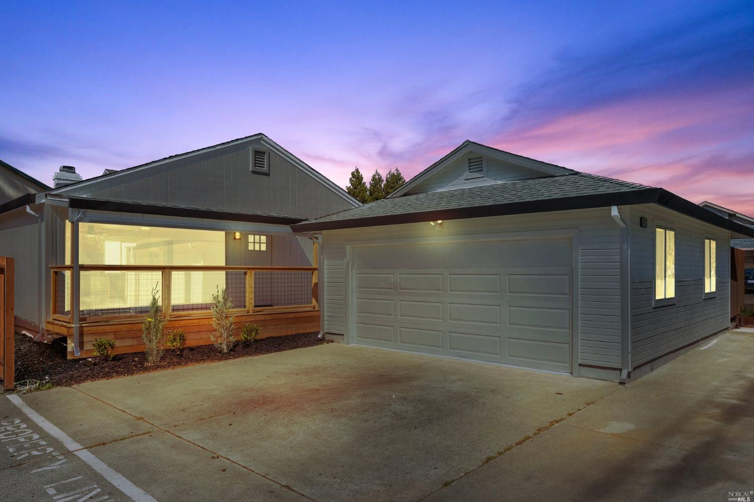 2431 Guerneville Road Santa Rosa, CA 95403 - Photo 1 of 1 a front view of a house with a yard