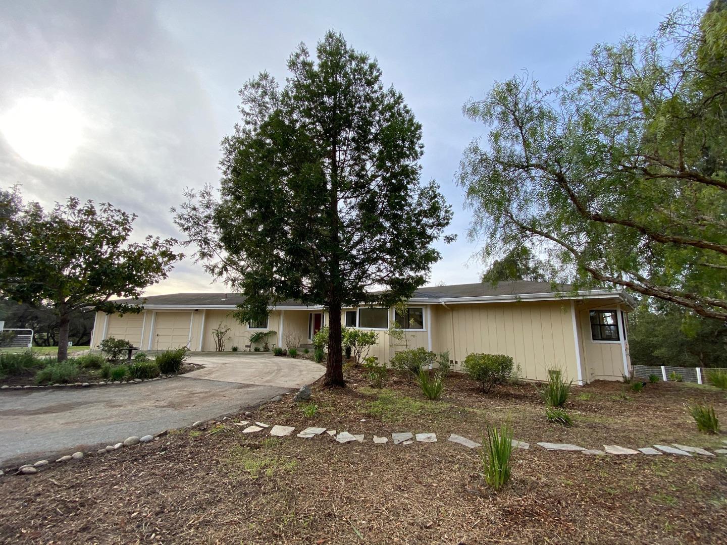 241 Webb Road Watsonville, CA 95076 - Photo 2 of 40 a view of a yard with a house and a tree
