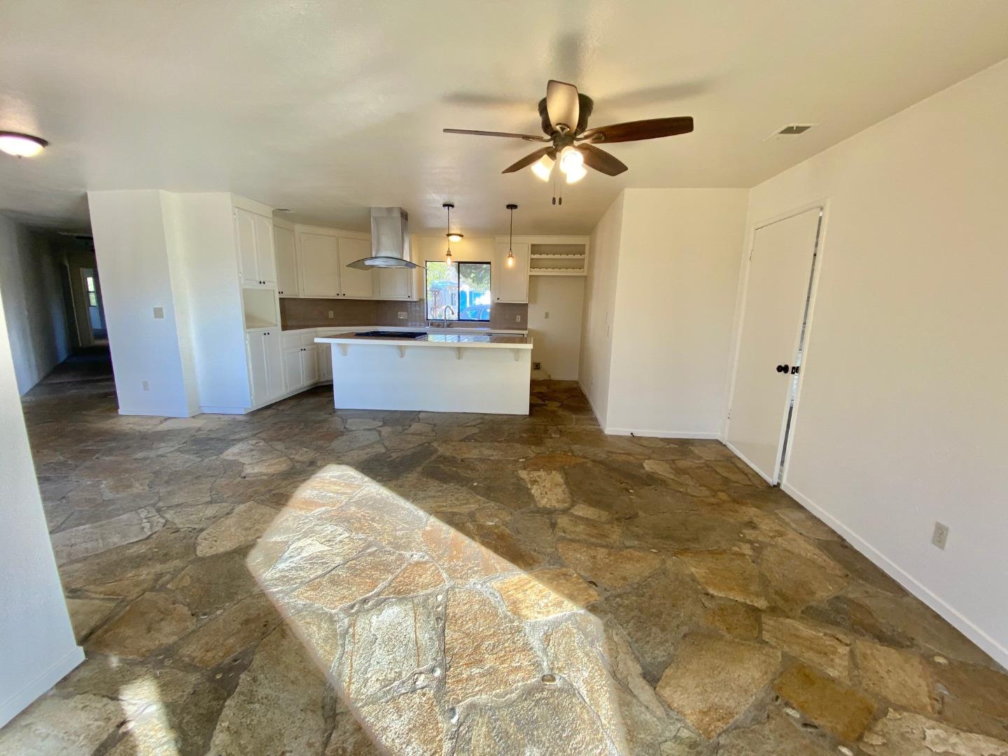 241 Webb Road Watsonville, CA 95076 - Photo 11 of 40 a open kitchen with kitchen island white cabinets and stainless steel appliances