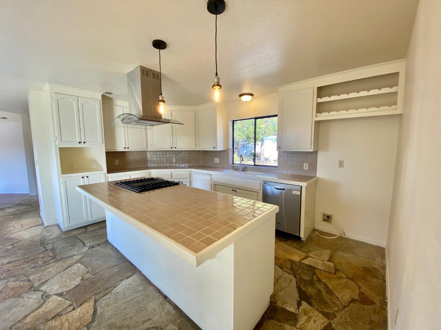 241 Webb Road Watsonville, CA 95076 - Photo 13 of 40 a kitchen with stainless steel appliances granite countertop a sink a stove and a refrigerator