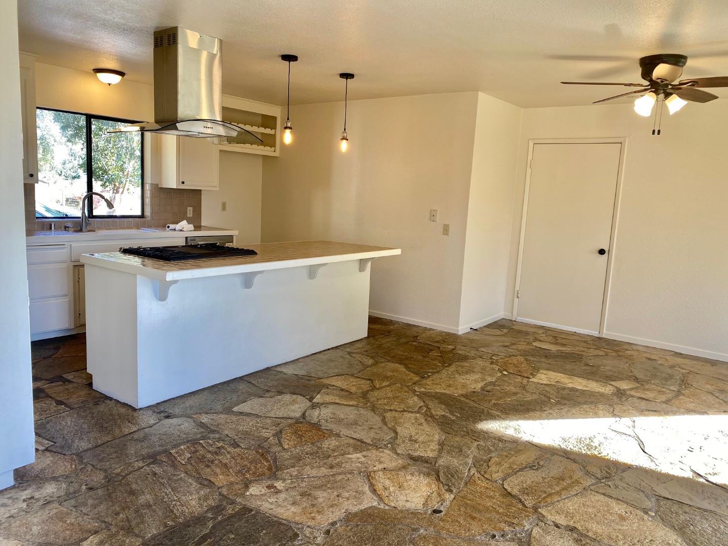 241 Webb Road Watsonville, CA 95076 - Photo 14 of 40 a kitchen with stainless steel appliances granite countertop a sink stove and refrigerator