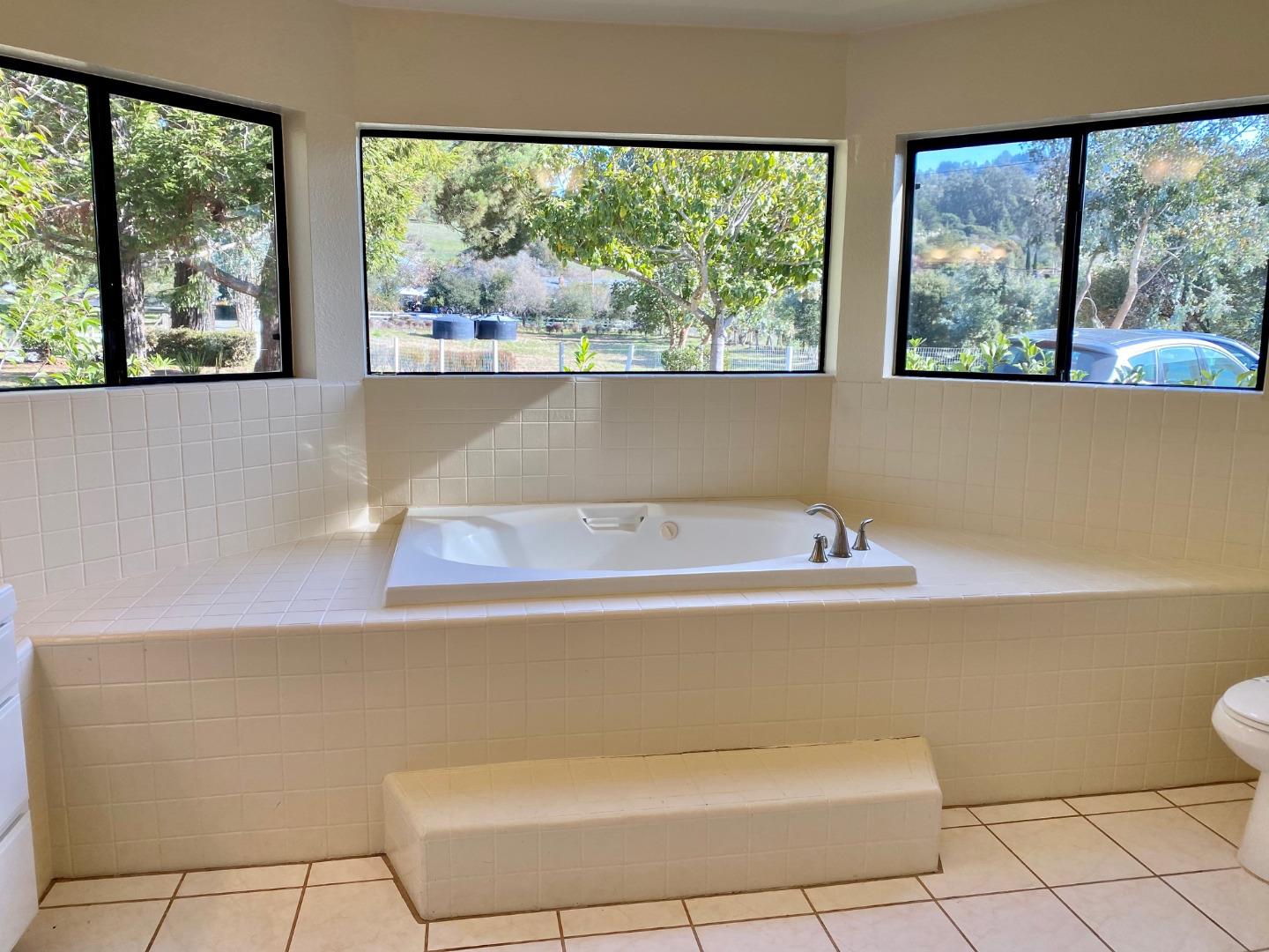 241 Webb Road Watsonville, CA 95076 - Photo 19 of 40 a view of a living room with a large window and floor to ceiling window