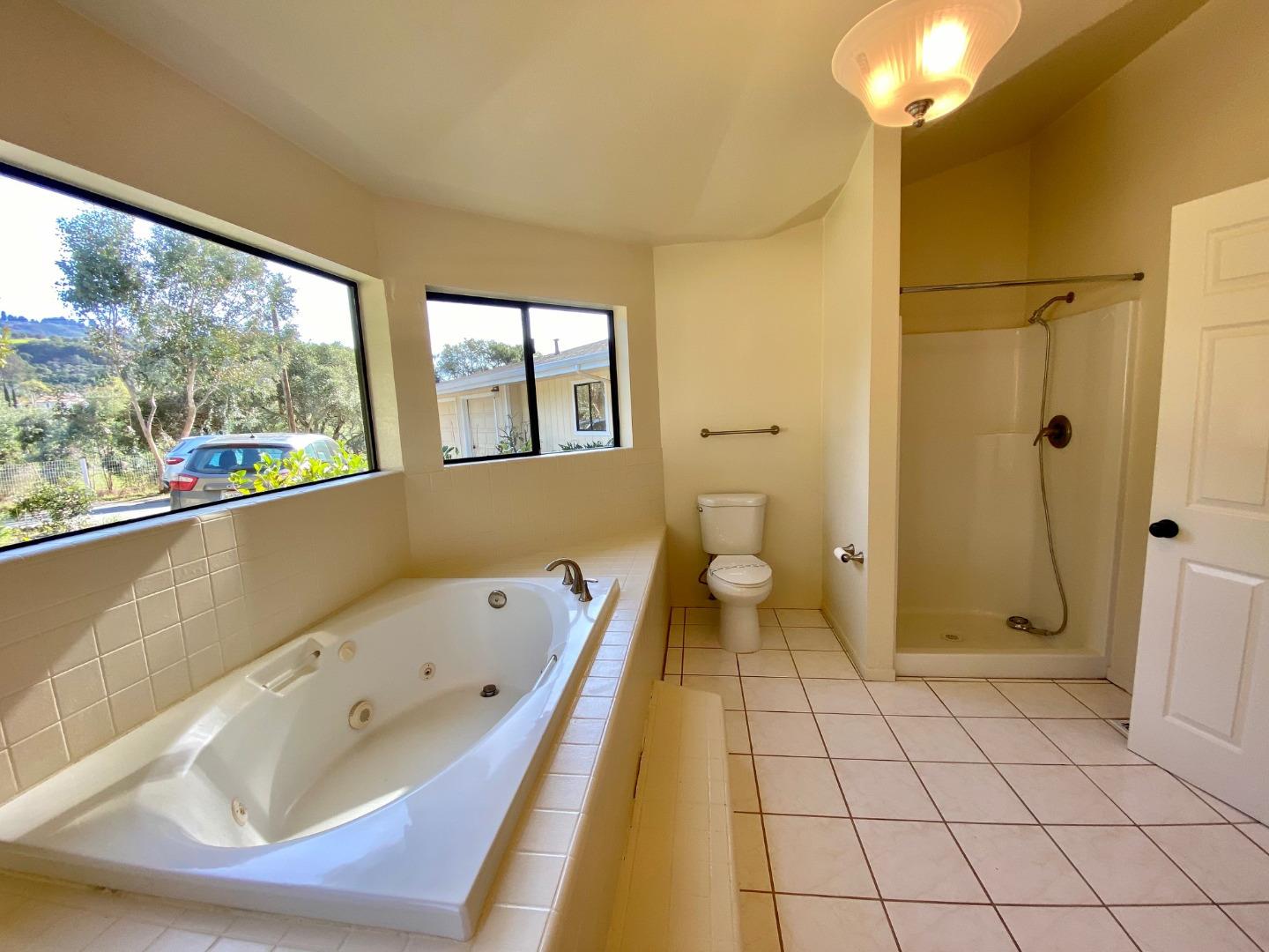 241 Webb Road Watsonville, CA 95076 - Photo 22 of 40 a bathroom with a bathtub and a shower