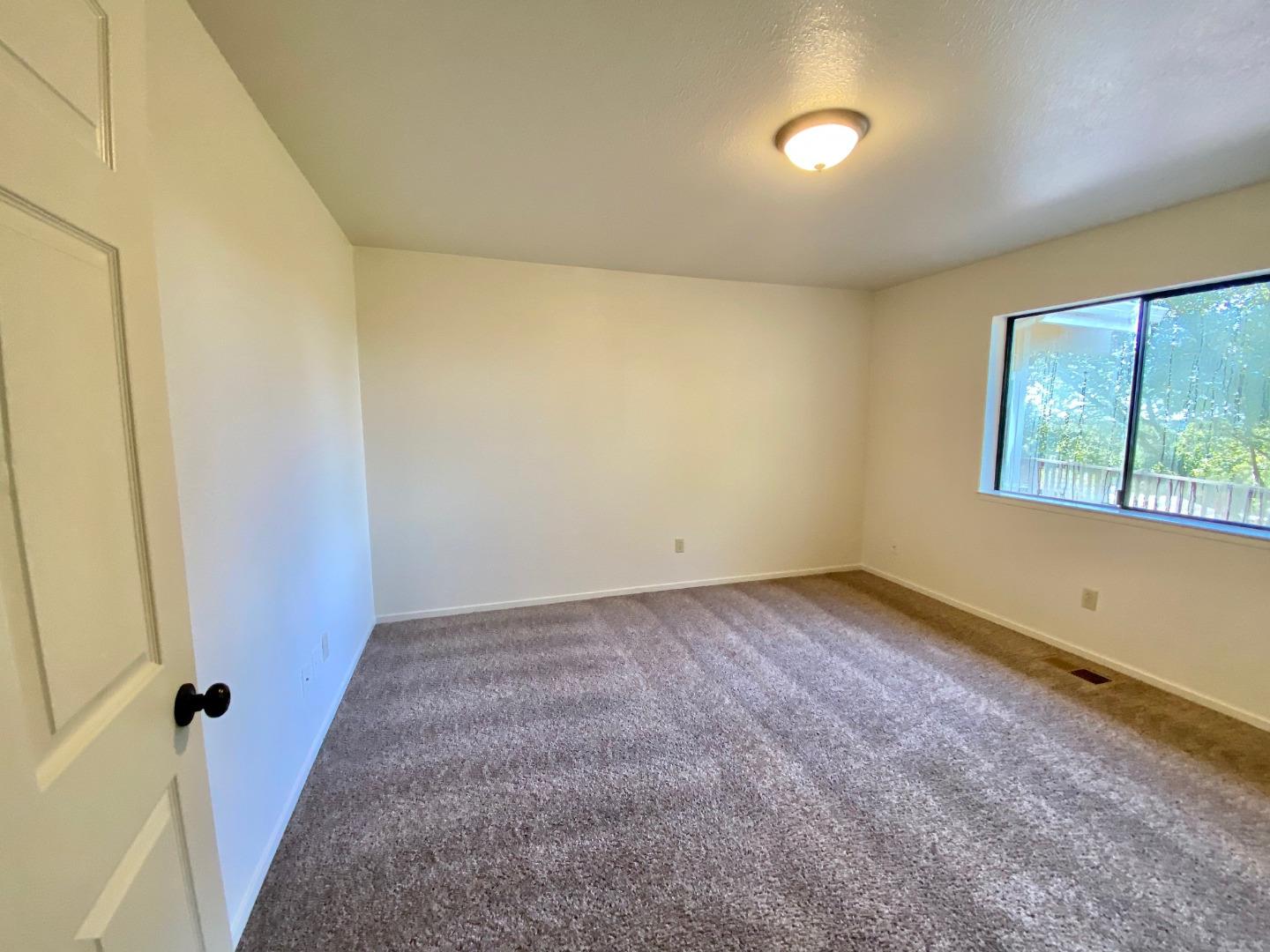 241 Webb Road Watsonville, CA 95076 - Photo 23 of 40 an empty room with windows