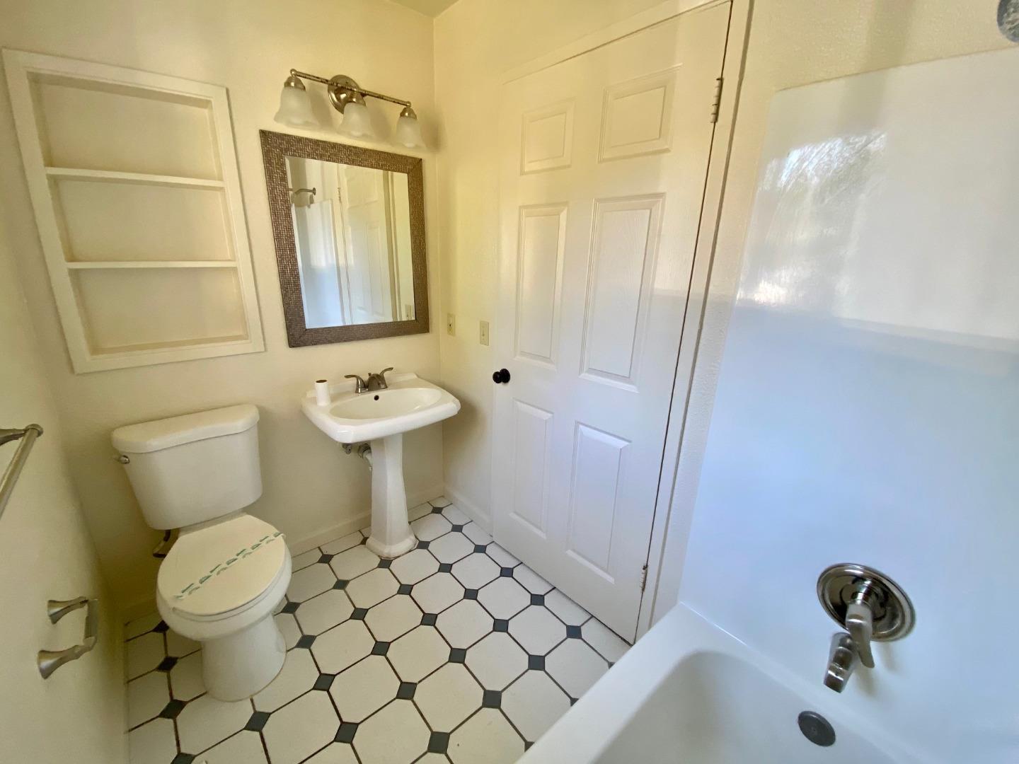 241 Webb Road Watsonville, CA 95076 - Photo 24 of 40 a bathroom with a sink toilet and shower