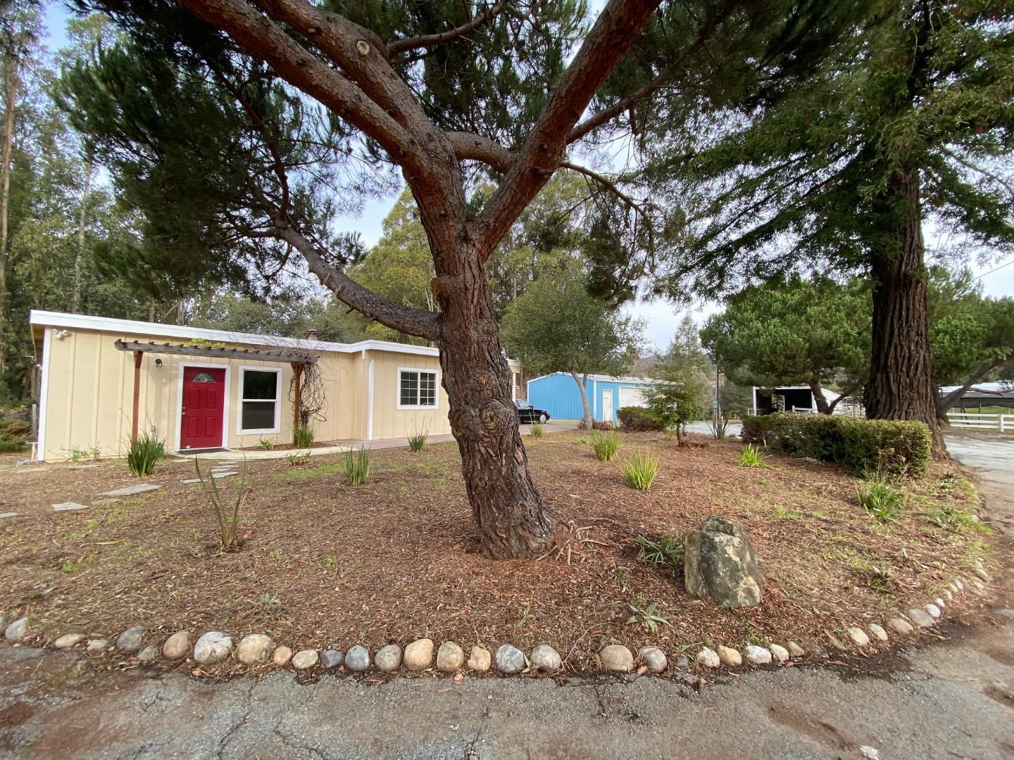 241 Webb Road Watsonville, CA 95076 - Photo 26 of 40 a front view of a house with a yard and garage