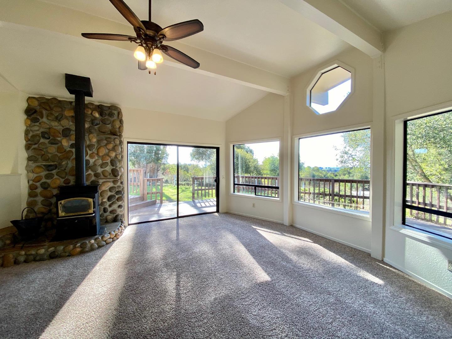 241 Webb Road Watsonville, CA 95076 - Photo 9 of 40 a view of an empty room with a window and a fan