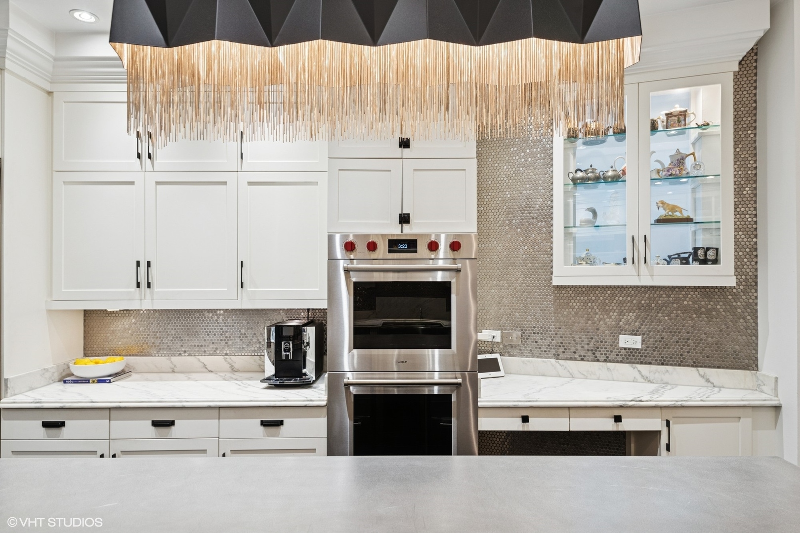 42 East Schiller Street Chicago, IL 60610 - Photo 15 of 50 a kitchen with granite countertop white cabinets and stainless steel appliances