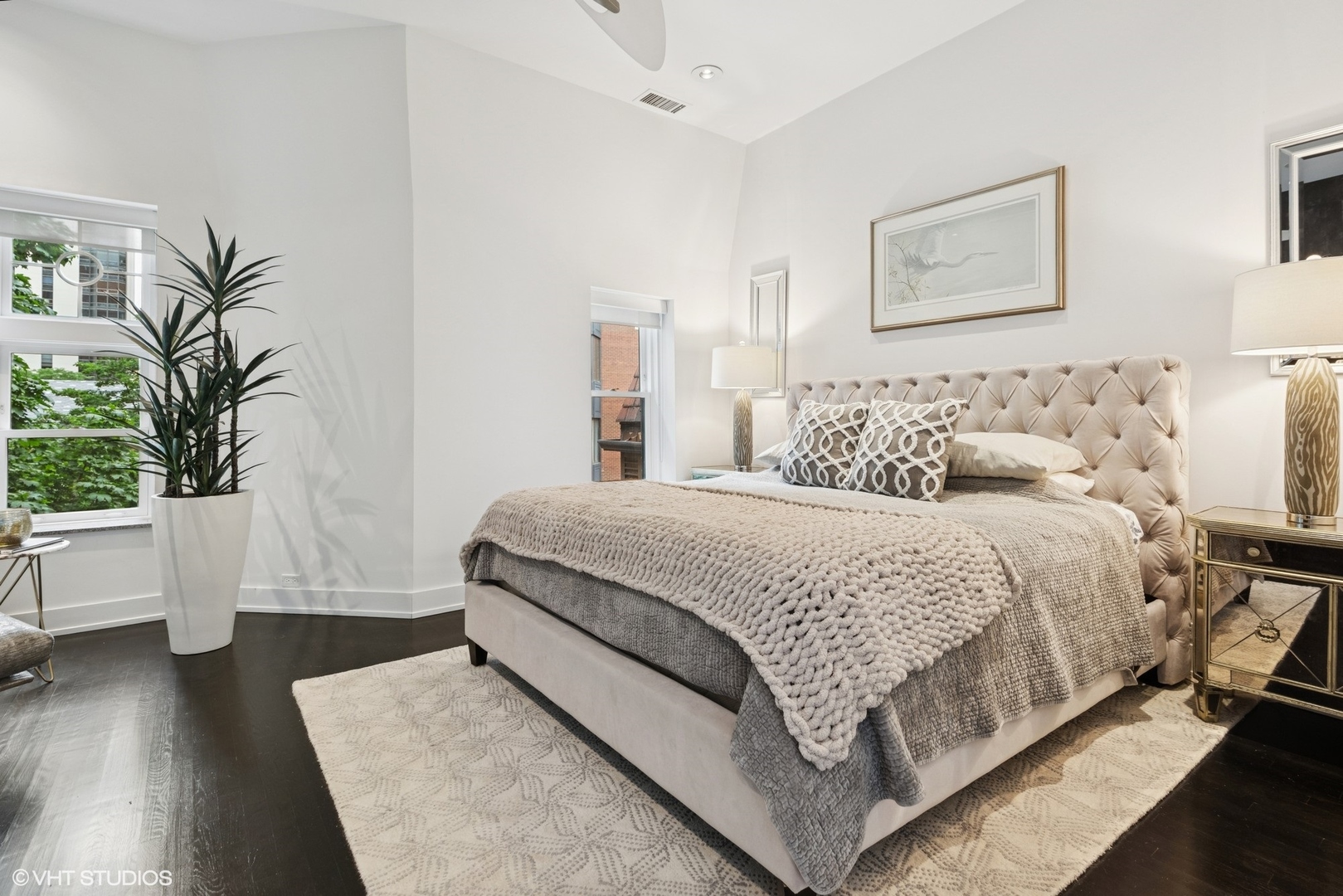42 East Schiller Street Chicago, IL 60610 - Photo 21 of 50 a bedroom with a large bed and a potted plant