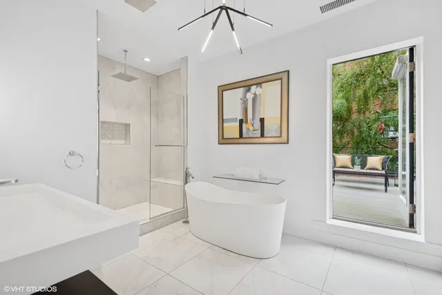 a spacious bathroom with a bathtub and sink