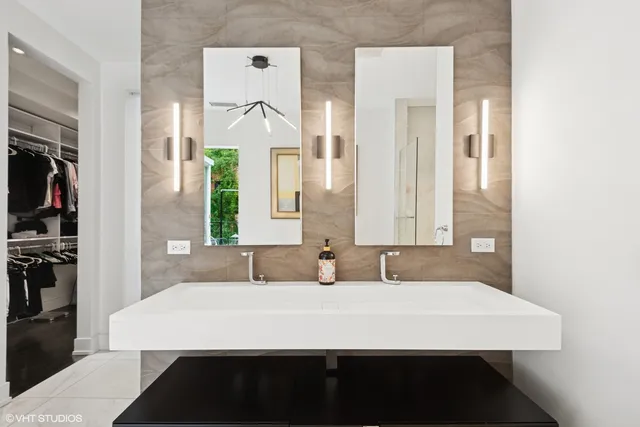 a large white bed in a white room