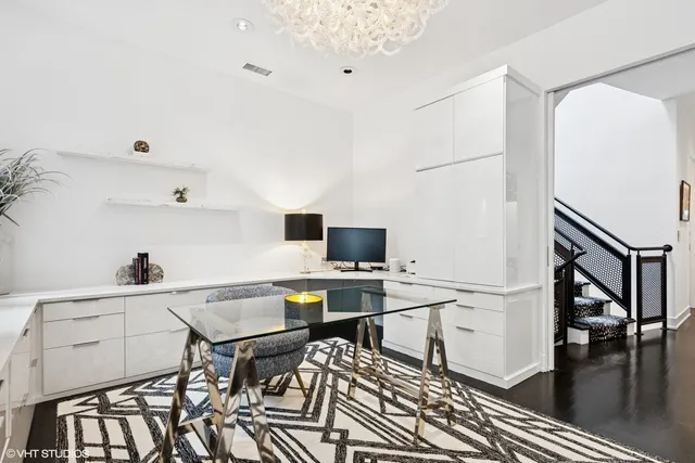 a workspace with furniture and wooden floor