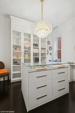 a view of living room with granite countertop furniture and chandelier