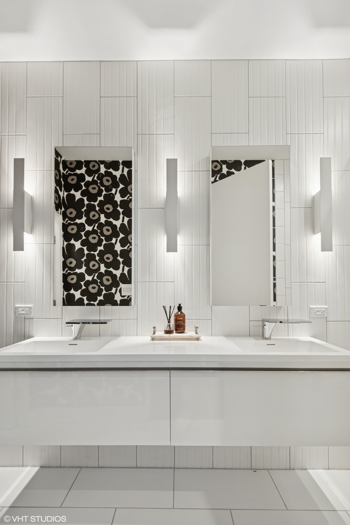 42 East Schiller Street Chicago, IL 60610 - Photo 36 of 50 a bathroom with a sink and a mirror