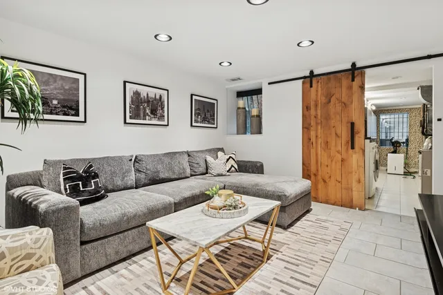 a living room with furniture and a rug
