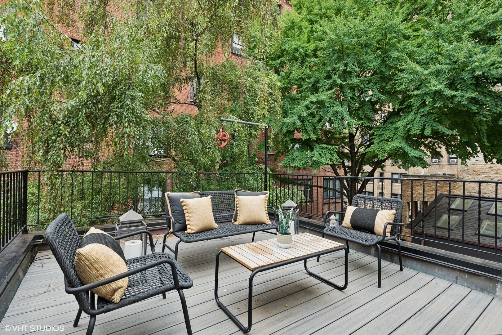 42 East Schiller Street Chicago, IL 60610 - Photo 45 of 50 a roof deck with couches and wooden fence