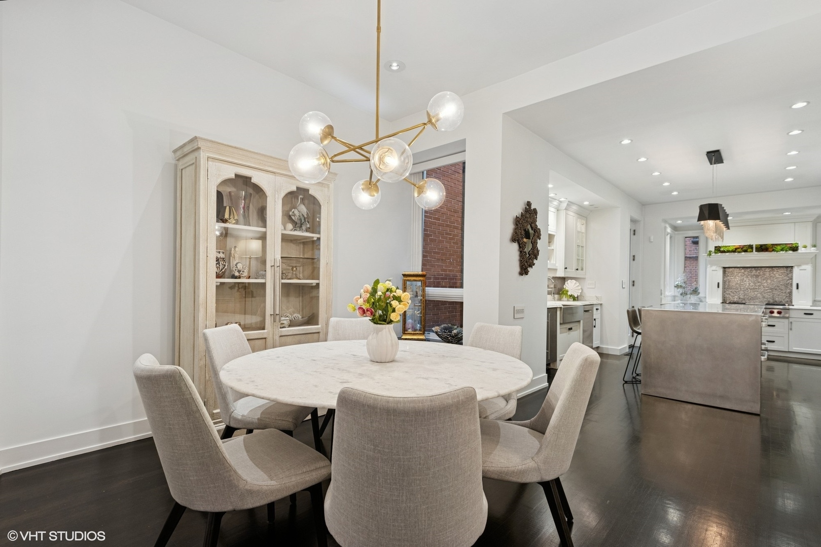 42 East Schiller Street Chicago, IL 60610 - Photo 9 of 50 a view of a dining room with furniture and wooden floor
