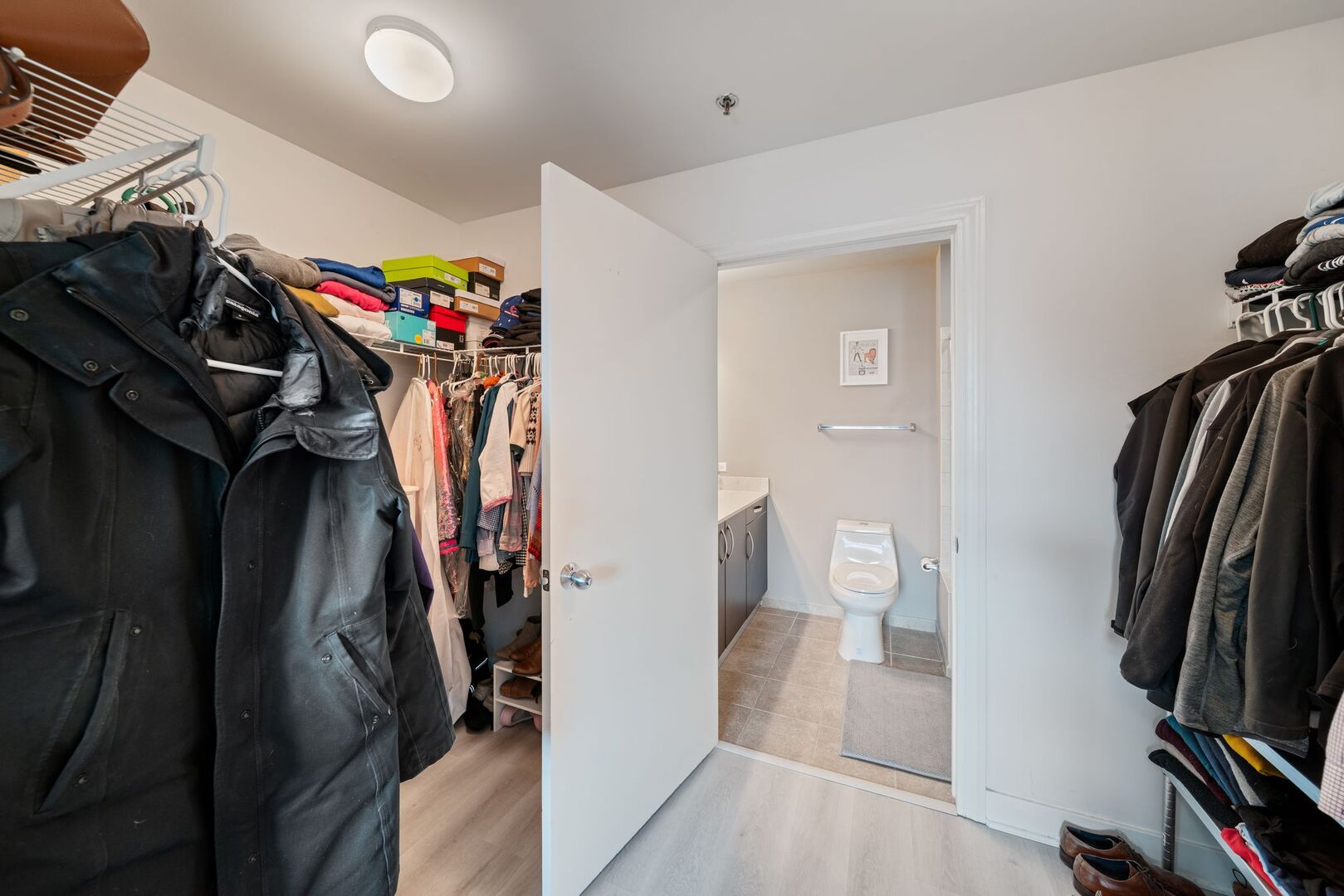 225 South Sangamon Street, Unit 308 Chicago, IL 60607 - Photo 15 of 34 a view of walk in closet with clothes and shoes