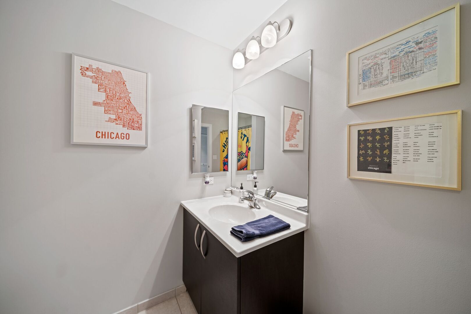 225 South Sangamon Street, Unit 308 Chicago, IL 60607 - Photo 19 of 34 a bathroom with a sink and a mirror