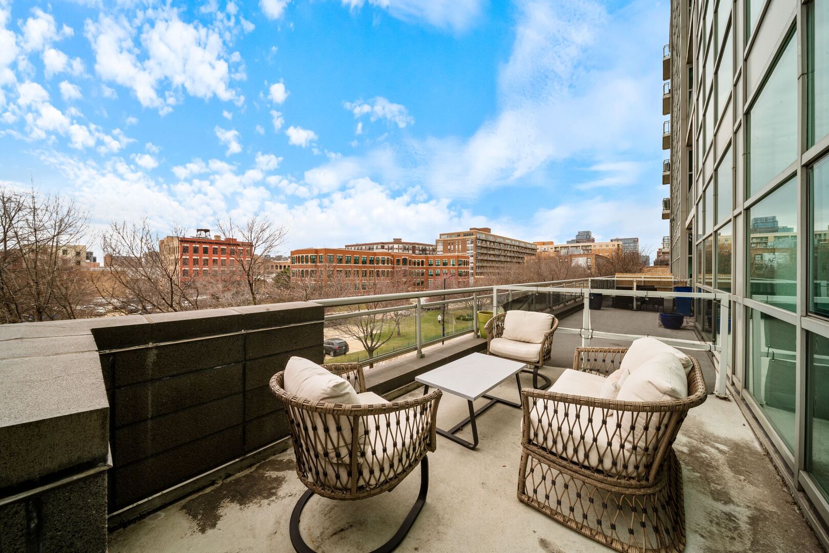 225 South Sangamon Street, Unit 308 Chicago, IL 60607 - Photo 23 of 34 a view of a balcony with two chairs and a couch