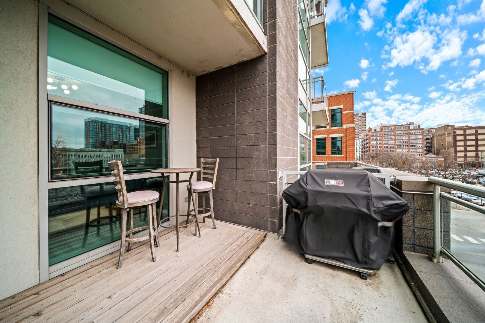 225 South Sangamon Street, Unit 308 Chicago, IL 60607 - Photo 25 of 34 a view of a chairs and table in the balcony