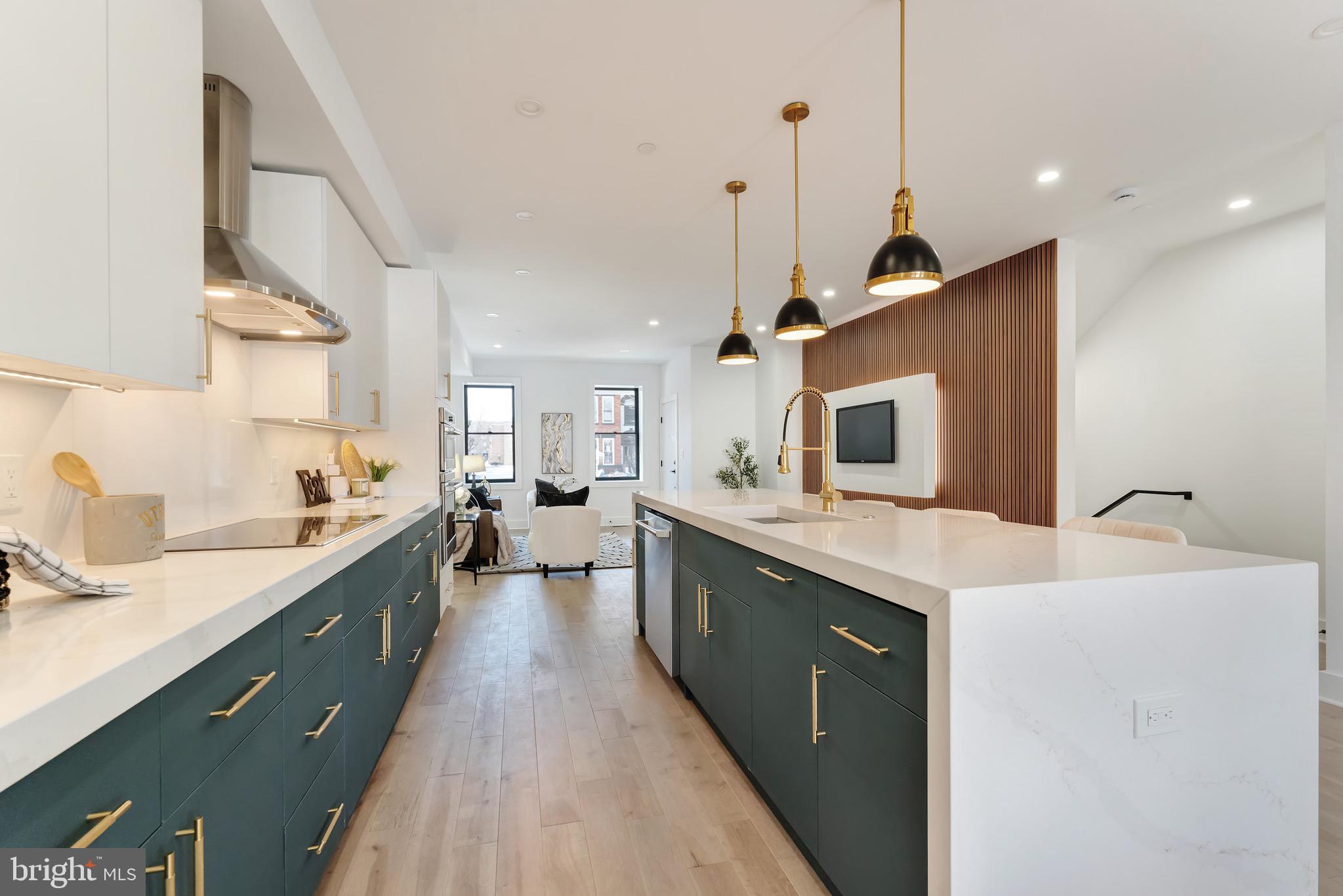 3009 13th Street Northwest, Unit 1 Washington, DC 20009 - Photo 10 of 42 a large kitchen with a sink and cabinets