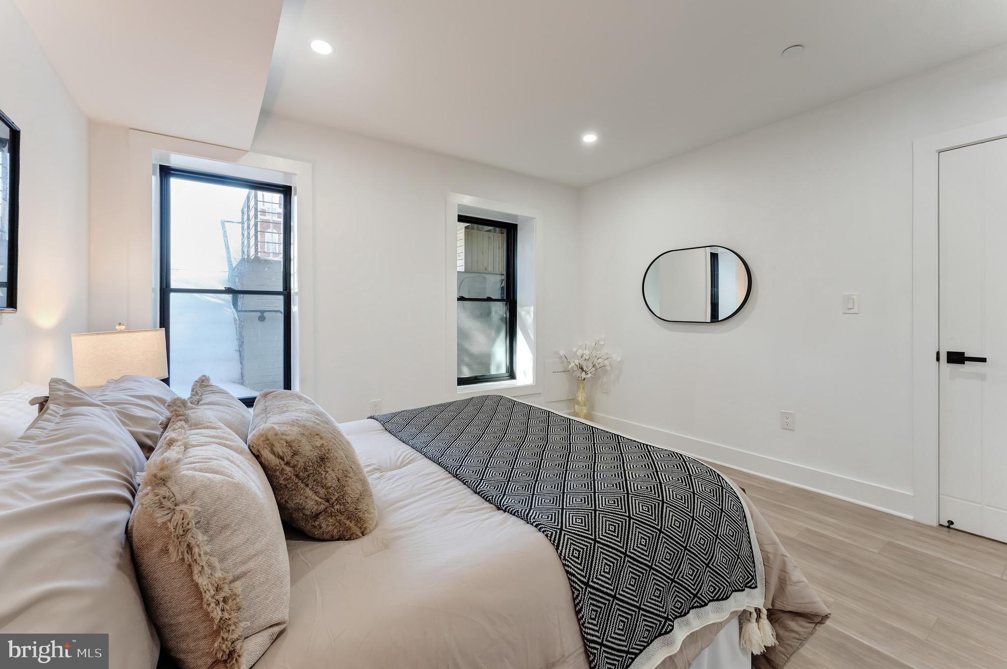 3009 13th Street Northwest, Unit 1 Washington, DC 20009 - Photo 23 of 42 a bedroom with a bed and window