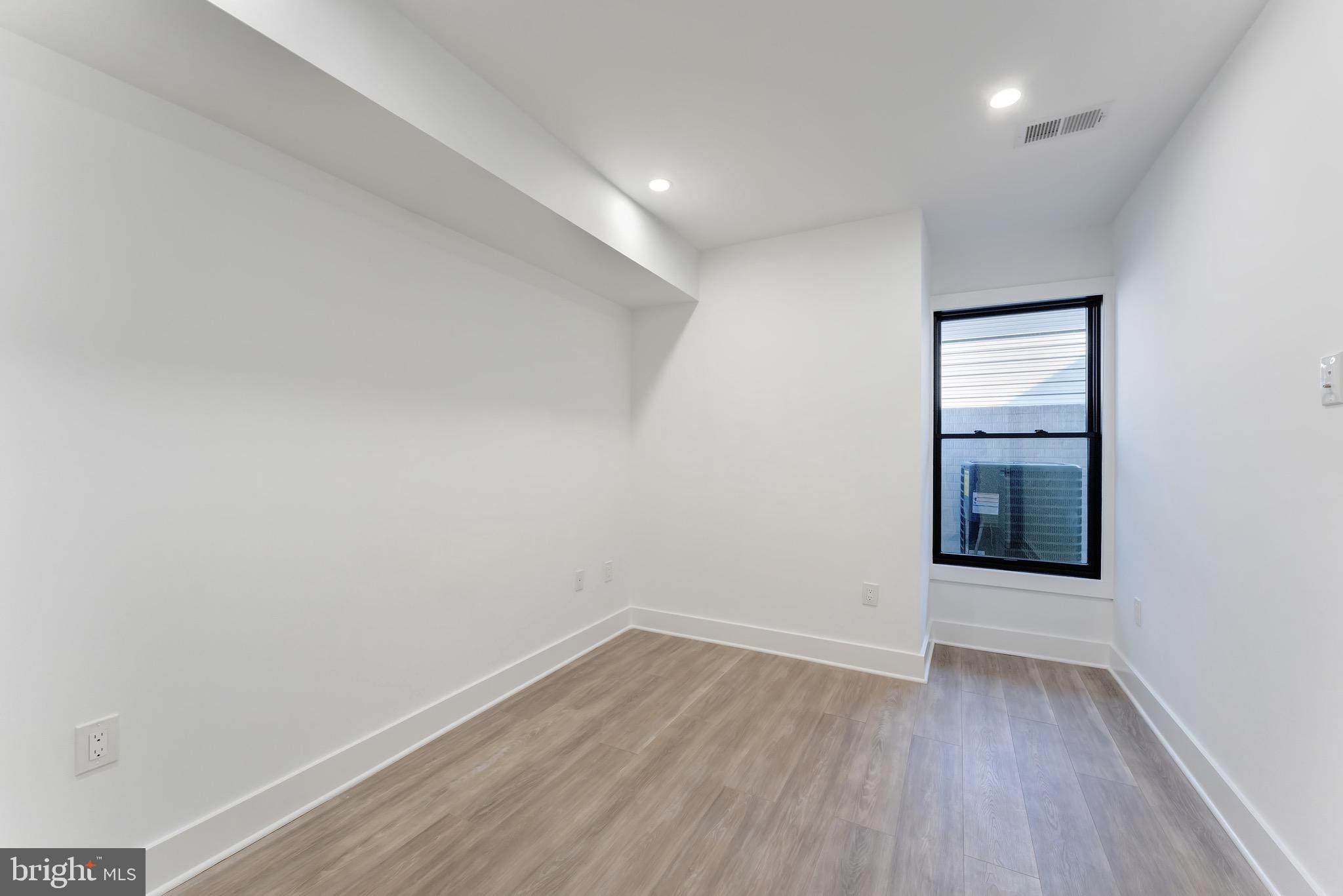 3009 13th Street Northwest, Unit 1 Washington, DC 20009 - Photo 26 of 42 wooden floor in an empty room