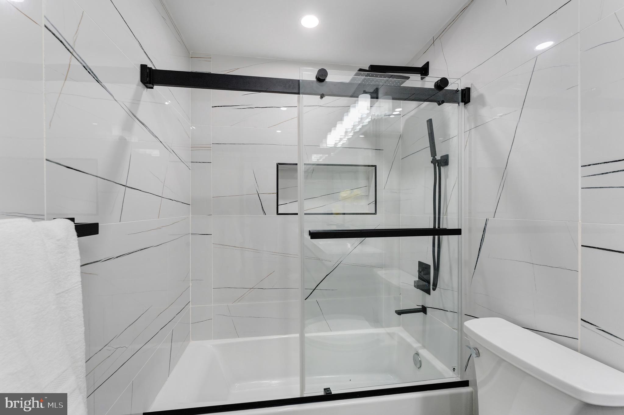 3009 13th Street Northwest, Unit 1 Washington, DC 20009 - Photo 31 of 42 a bathroom with a shower and a sink