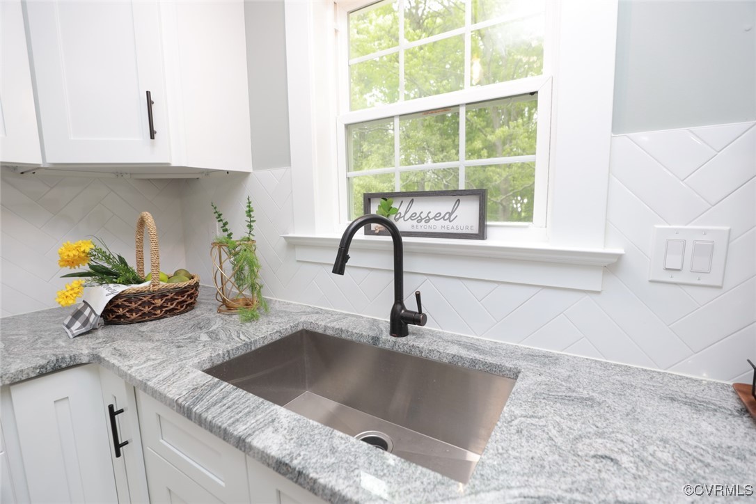 901 Rosegill Road Chesterfield, VA 23236 - Photo 12 of 30 a kitchen with granite countertop a sink and a window