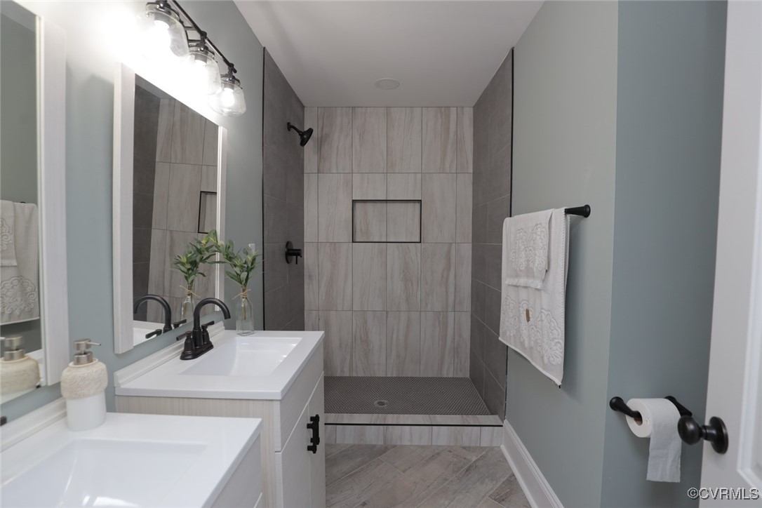 901 Rosegill Road Chesterfield, VA 23236 - Photo 21 of 30 a bathroom with a sink a toilet and shower