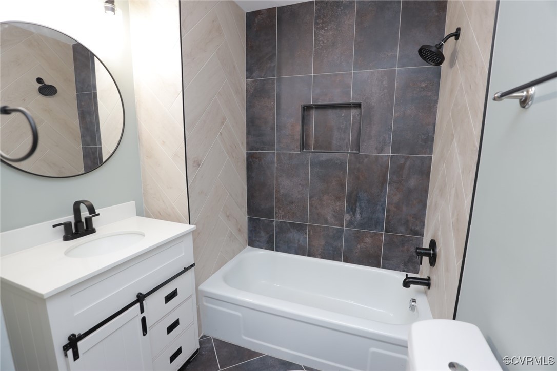901 Rosegill Road Chesterfield, VA 23236 - Photo 26 of 30 a bathroom with a sink a toilet and a mirror