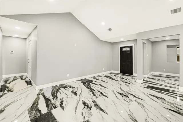 a bedroom with a bed and a mirror