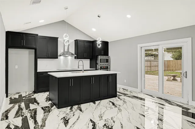 a bedroom with a bed and a television