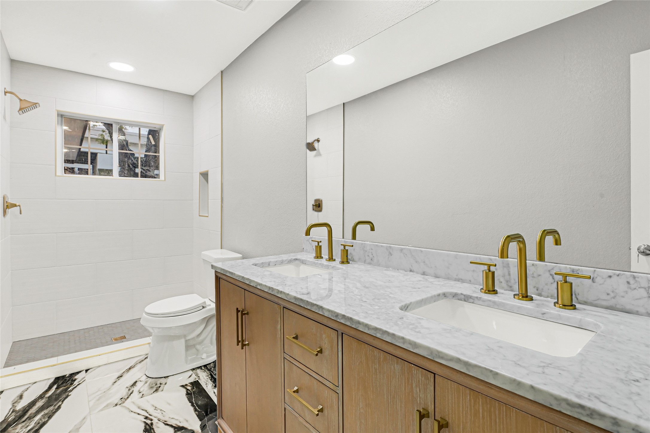 3822 Darling Avenue Pasadena, TX 77503 - Photo 10 of 19 a bathroom with a granite countertop sink a toilet and a mirror