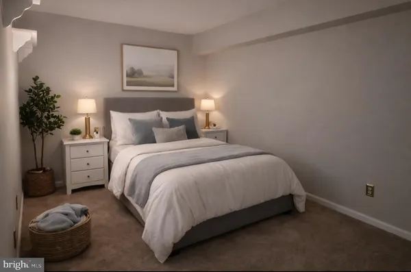 a bedroom with a bed and a potted plant