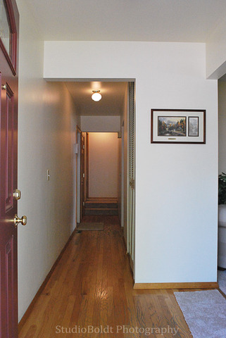 89 Fernwood Road Montgomery, IL 60538 - Photo 3 of 18 a view of a hallway with wooden floor